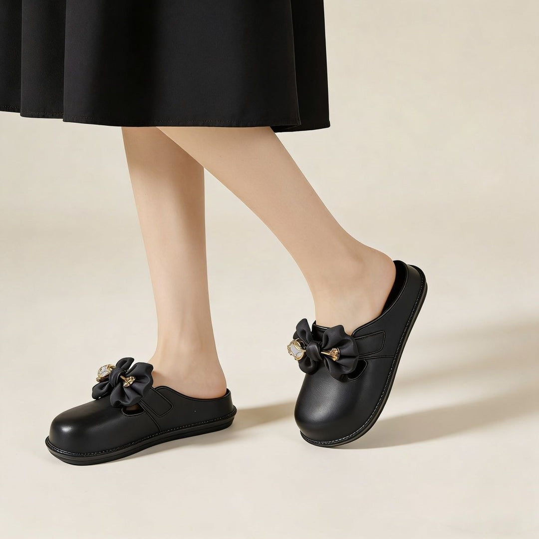 Bow-embellished closed-toe, open-back mules