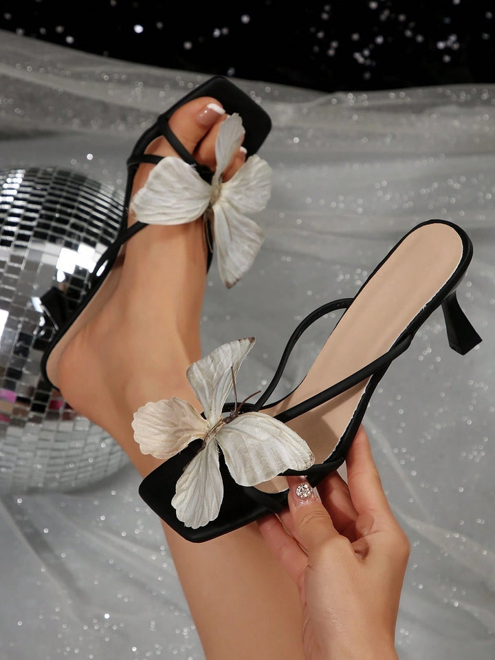 Butterfly-decorated high-heeled sandals